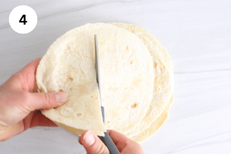 Scissors cutting tortillas.