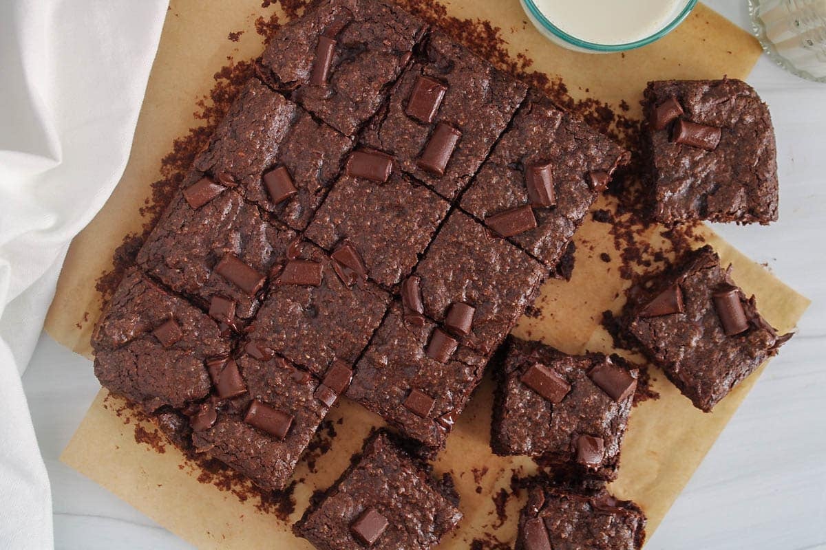Parchment paper covered with squares of buckwheat brownies.