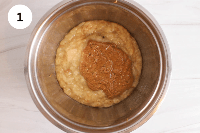 A bowl with mashed bananas and almond butter.