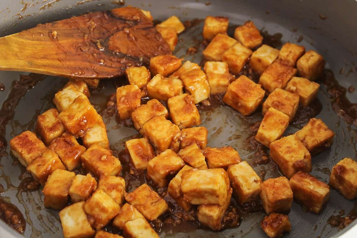 A pan with a saucy tofu in garlic ginger sauce.