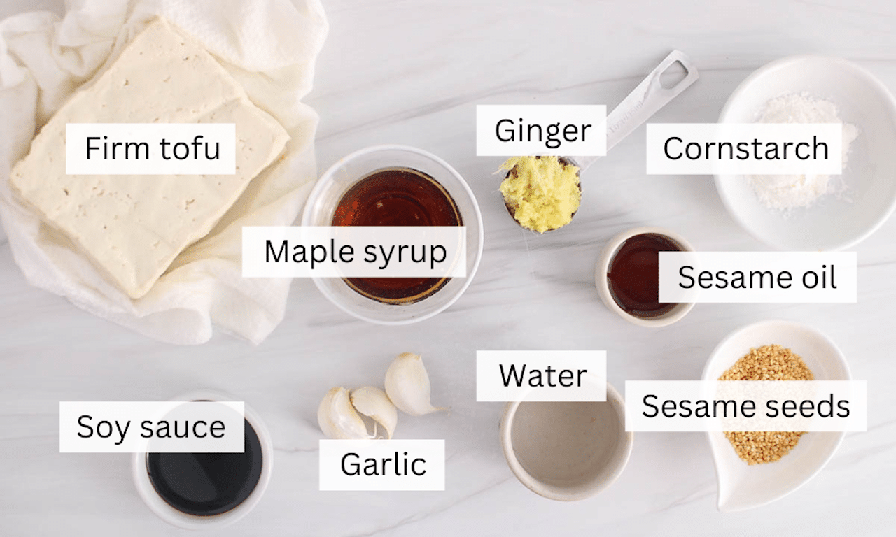 Showing are the ingredients needed to make sesame ginger tofu placed on a table.