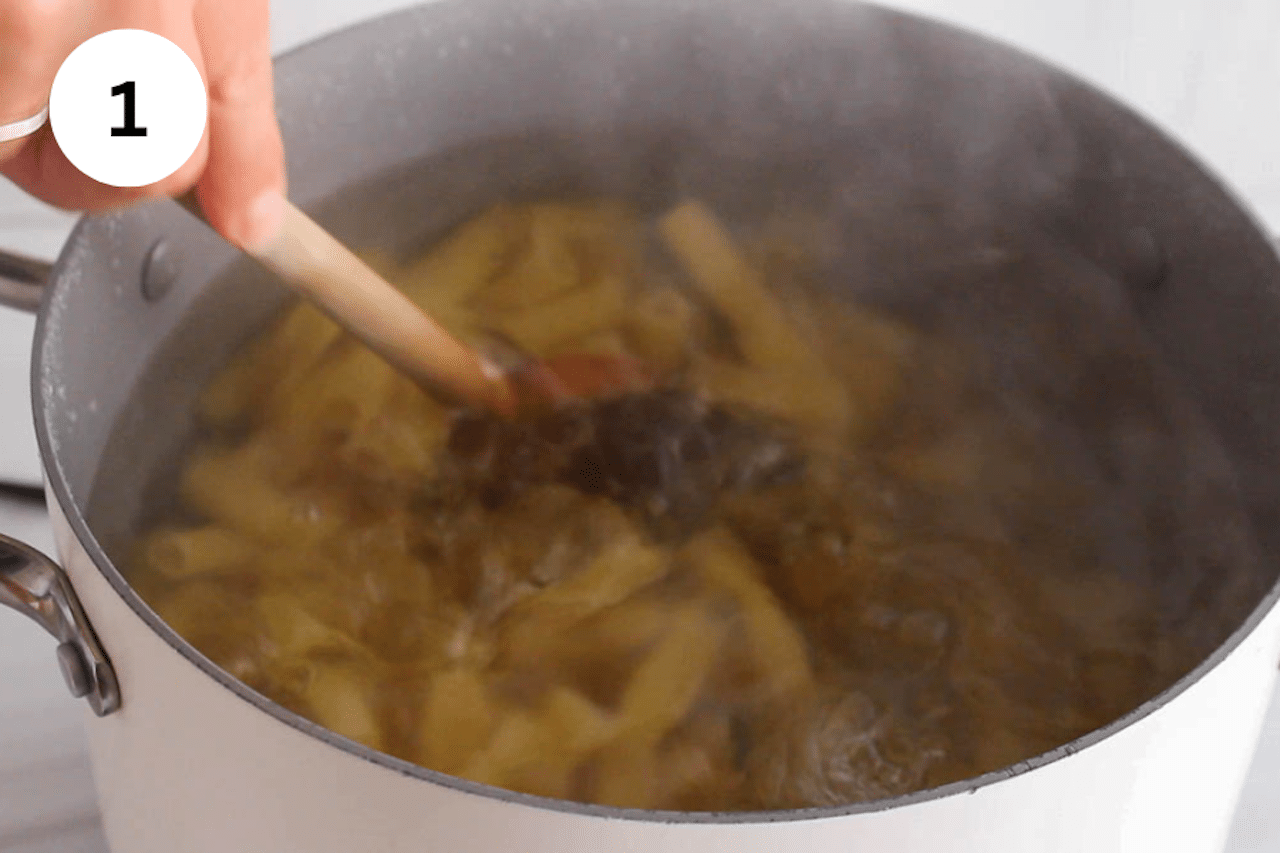A large pot of water cooking pasta.