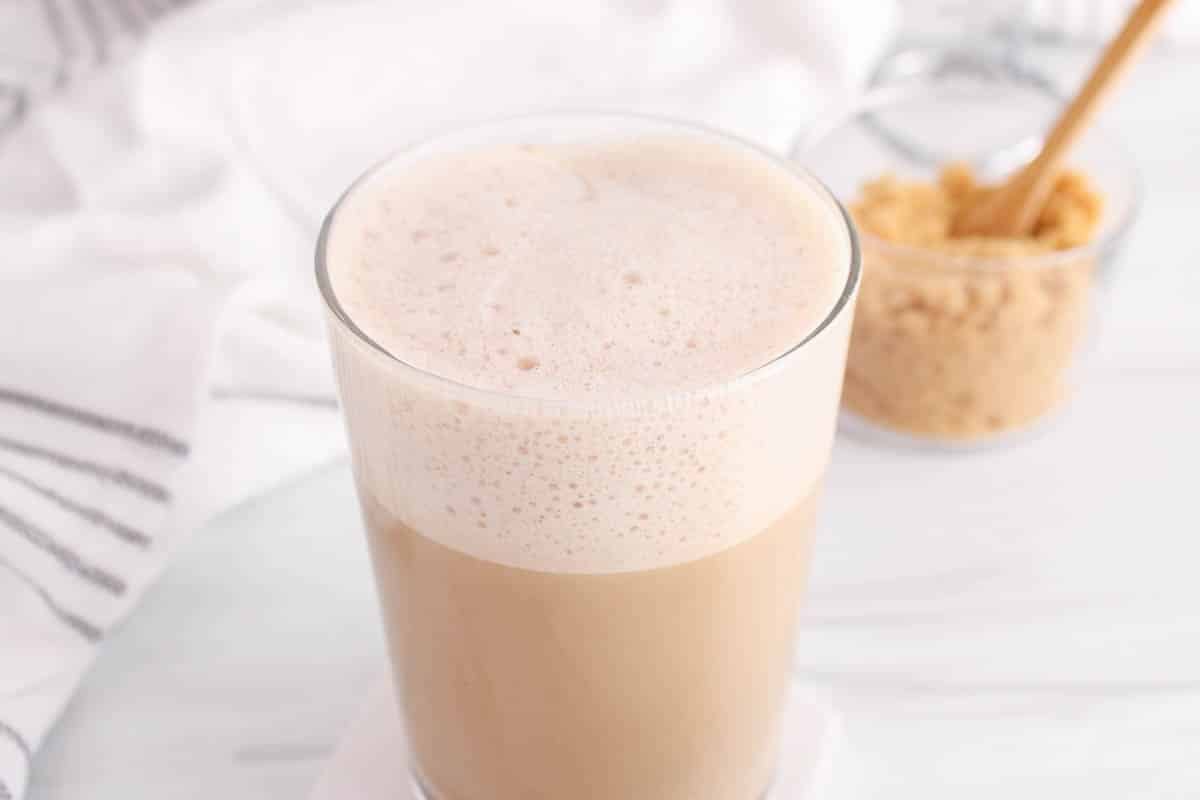 Showing the frothy milk over a oat milk brown sugar latte.