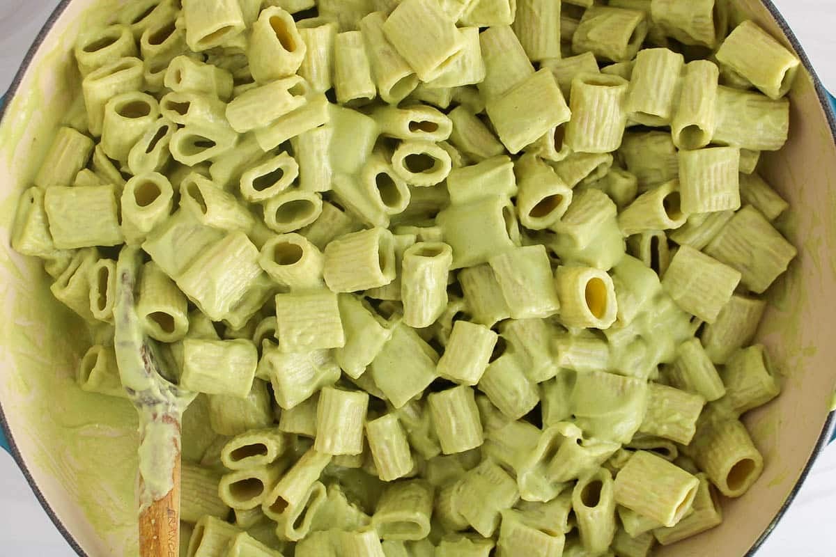 Large pan with vegan zucchini rigatoni pasta.