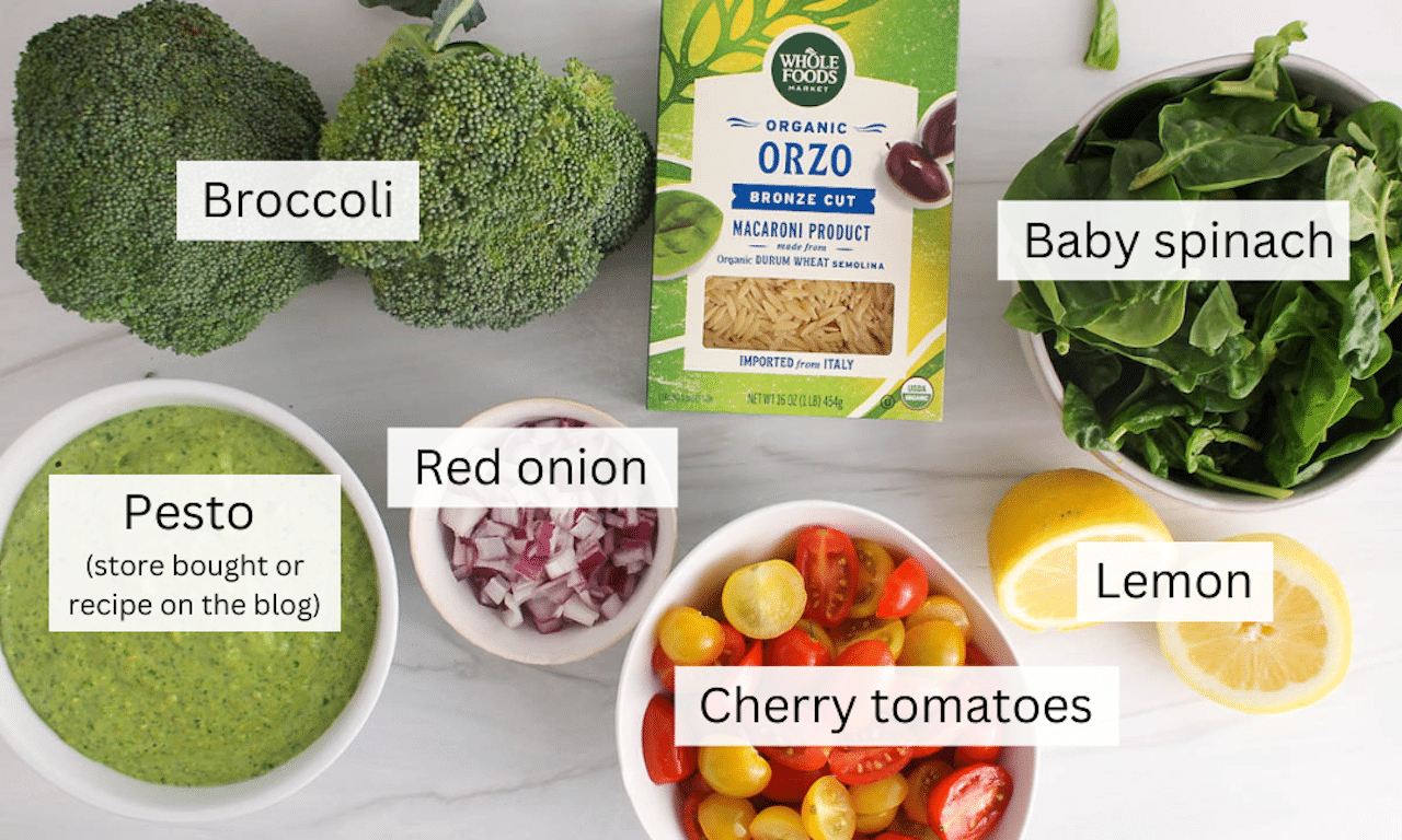 Showing are the ingredients needed to make a pesto orzo pasta salad placed on the counter.